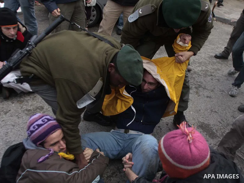 Israeli police arrest demonstrators during a demonstration against Jewish settlements and in solidarity with Palestinian families who were evicted from their homes in the Sheikh Jarrah neighbourhood of East Jerusalem Dec...