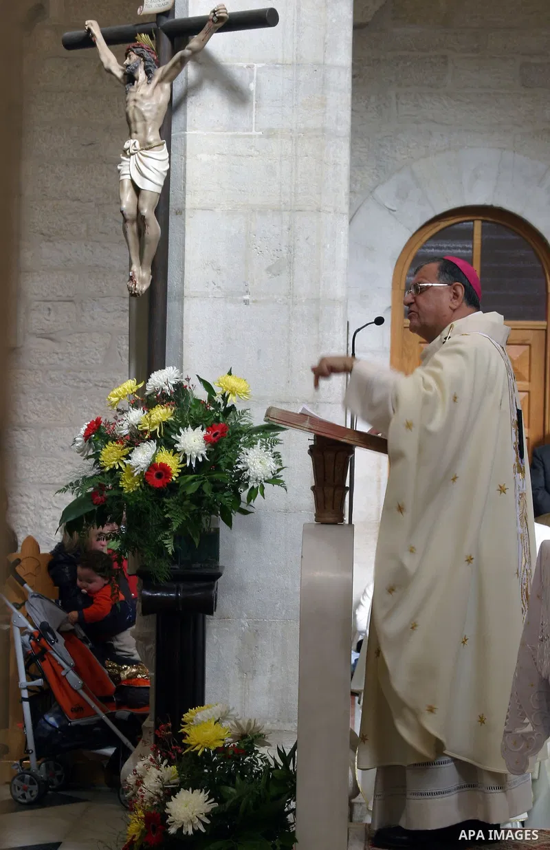 Latin Patriarch of Jerusalem Fuad Twal leads the Christmas mass at the Church of the Nativity in the West Bank town of Bethlehem on 25 December 2009. Twal, the top Roman Catholic cleric in the Holy Land, called on the fa...