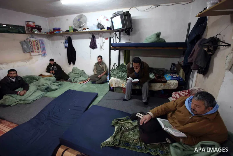 Palestinian Hamas read Quraan in their cell at Hebron Prison in the West Bank city of Hebron, 25 January 2010. Palestinian security forces have stopped torturing Hamas prisoners on 25 January, ending two years of systema...