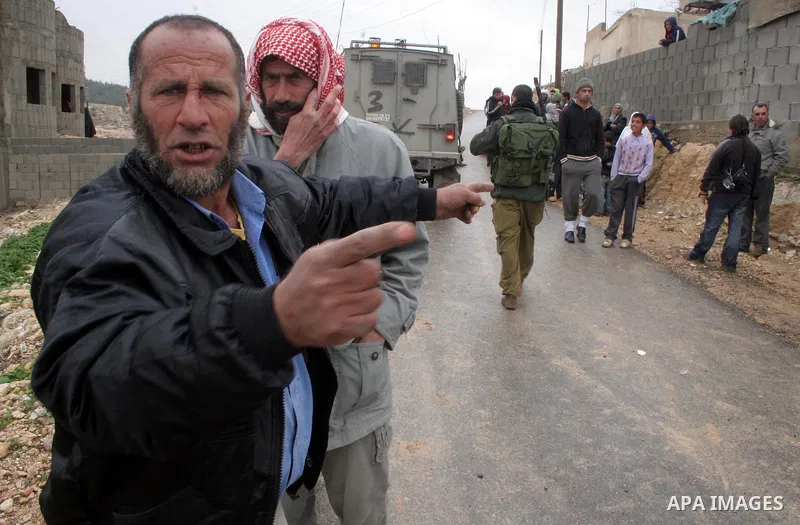 Israeli policemen stand guard after a confrontation between settlers with Palestinians in Twanie near the West Bank village of Yatta southern the West Bank city of Hebron January 26,2010. Photo by Najeh Hashlamoun