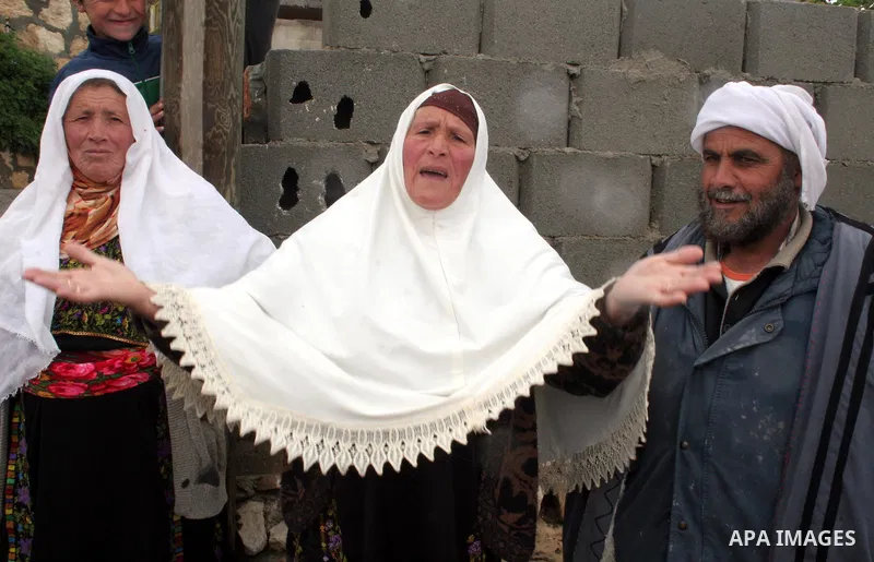 Palestinian woman reacts after a confrontation between settlers with Palestinians in Twanie near the West Bank village of Yatta southern the West Bank city of Hebron January 26 2010. Photo by Najeh Hashlamoun