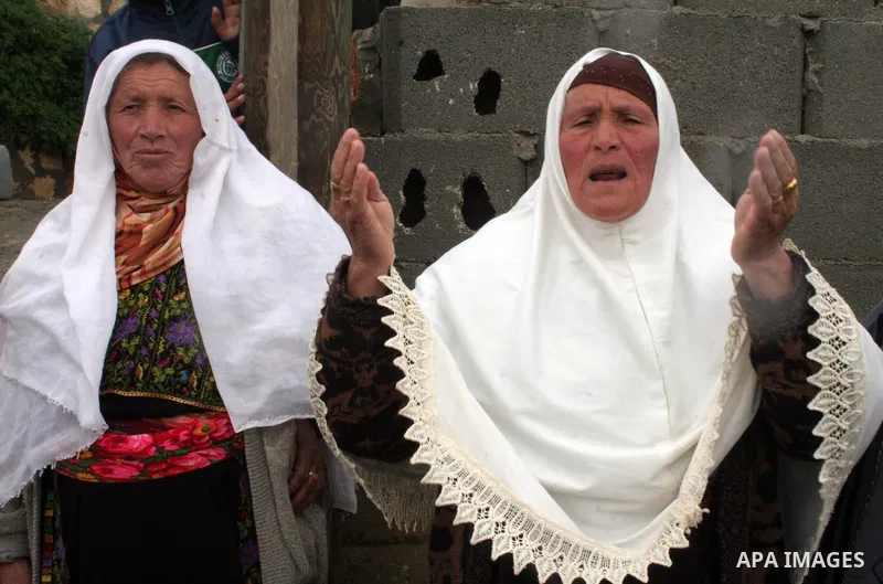 Palestinian woman reacts after a confrontation between settlers with Palestinians in Twanie near the West Bank village of Yatta southern the West Bank city of Hebron January 26 2010. Photo by Najeh Hashlamoun