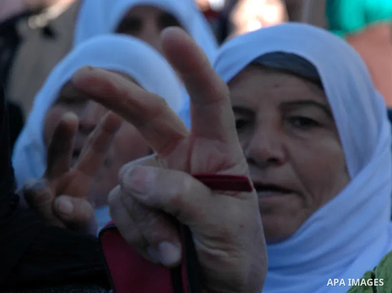 Palestinians take part in a protest calling for the release of prisoners from Israeli jails in the West Bank city of Nablus on January 27, 2010. At least 7500 Palestinians were being held in Israeli jails and detention f...