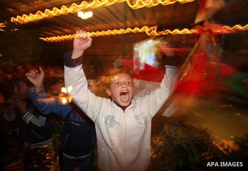 Palestinians celebrate in Gaza City after Egypt won the 2010 African Cup of Nations in Angola on January 31, 2010. Egypt entered the record books, beating Ghana 1-0 in the final of the Africa Cup of Nations with supersub...