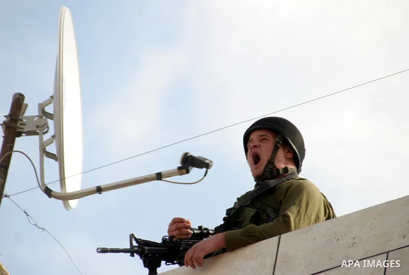 Israeli soldier takes position during clashes with the Palestinian in the West Bank city of Hebron on February 23, 2010. , after Israel's Prime Minister Benjamin Netanyahu was quoted in a statement as saying that the Tom...