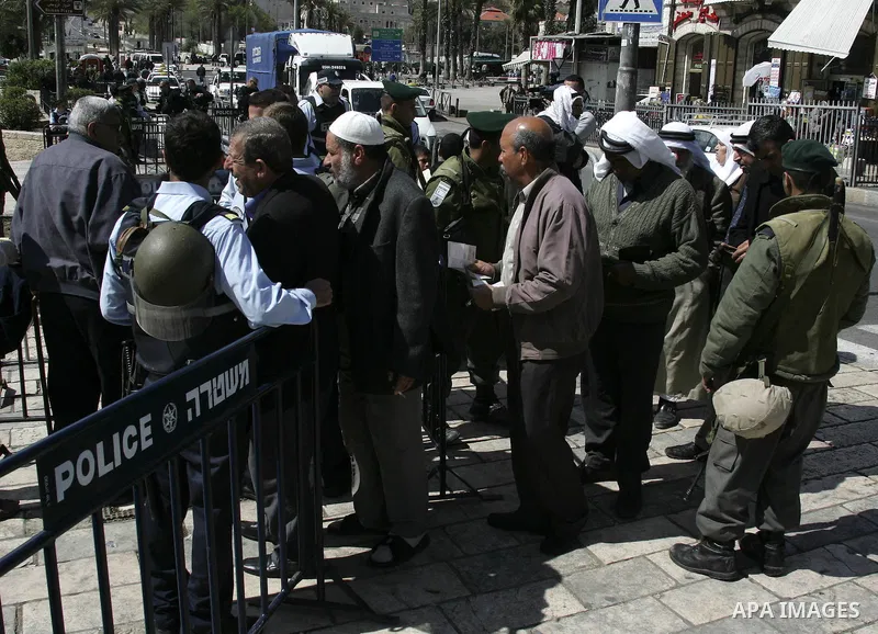 Israeli soldiers stand guards outside the Al-Aqsa Mosque pray during Friday prayers outside Jerusalem's Old City, Friday, March 19, 2010. Palestinians in east Jerusalem and the West Bank lobbed rocks at Israeli security...