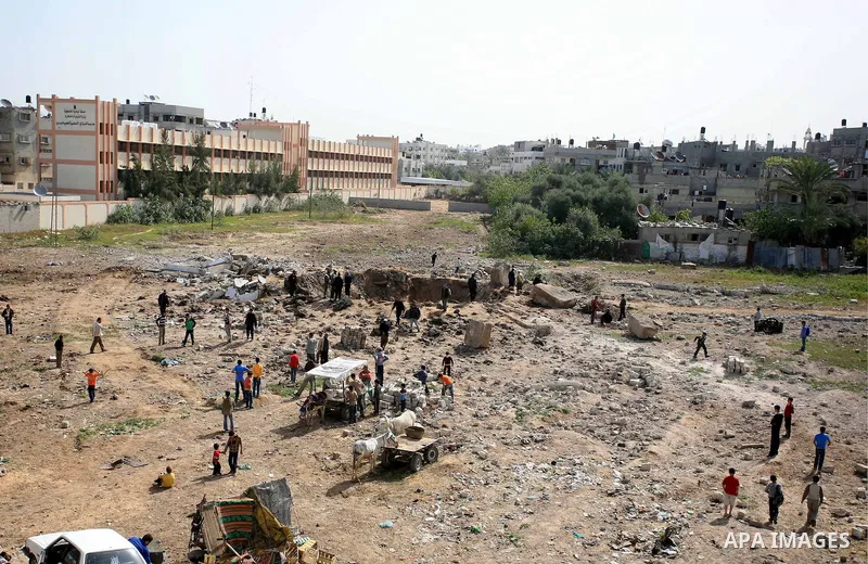 Palestinians inspect the damage after an Israeli army airstrike in Gaza City, Tuesday, March 23, 2010. The Israeli air strike on the Gaza Strip overnight injured four people, Palestinian security officials and witnesses...
