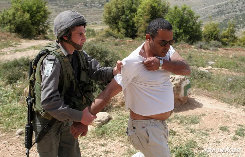 Israeli border policemen and Israeli soldiers clash with Palestinian and left-wing Israeli activists during a protest on agricultural land in the southern West Bank village of Safa, near Beit Ein settlement near Hebron o...