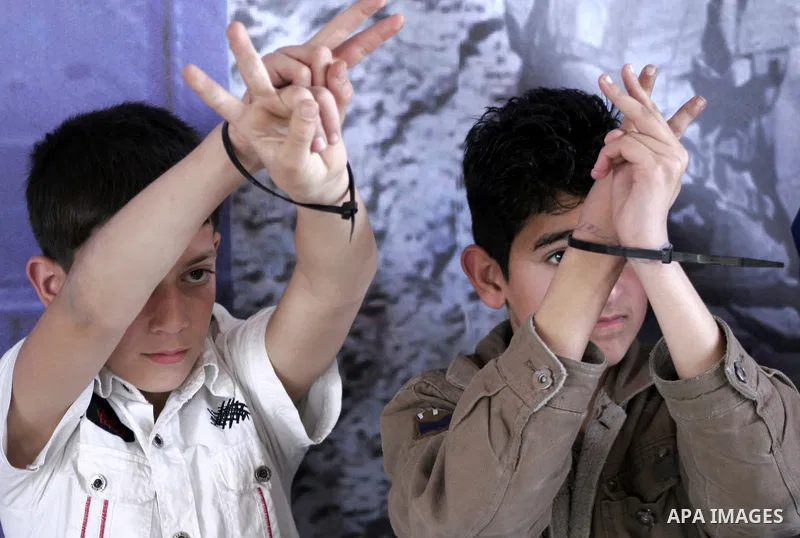 Palestinians children participate in a protest to mark the Prisoner Day in Gaza City on April 18, 2010. More than 7,000 Palestinians, including 270 who are under the age of 18, are currently held in Israeli prisons, the...
