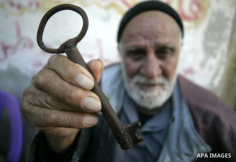 Abdullah Abed Aziz Essa, a 83-year-old Palestinian refugee living in the Rafah Refugee Camp in the southern Gaza Strip, as he shows the key of his family's home that he says is in Beit Tima, now part from Israel, on May...