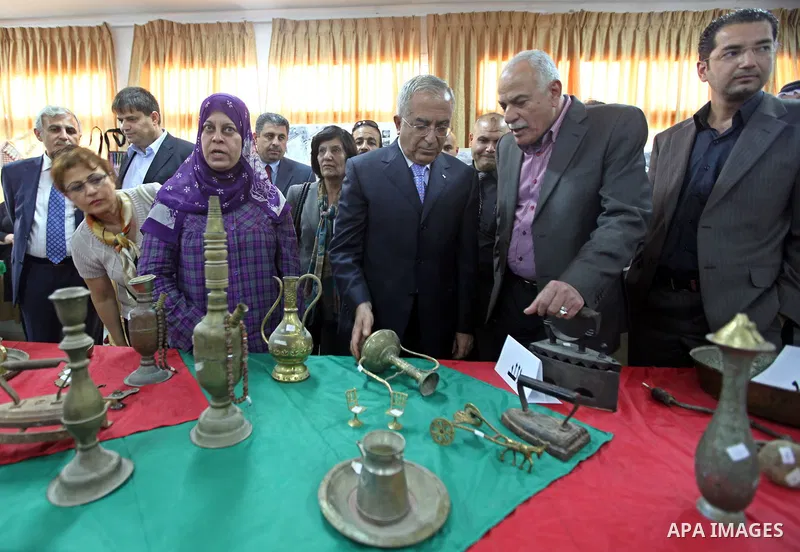 Palestinian Prime Minister Salam Fayyad during his visits to exhibition of "Mn-rehet Beladi", at the women's center in Al Amari refugee camp near the West Bank city of Ramallah on May 12,2010. Photo by Mustafa Abu Dayeh\...