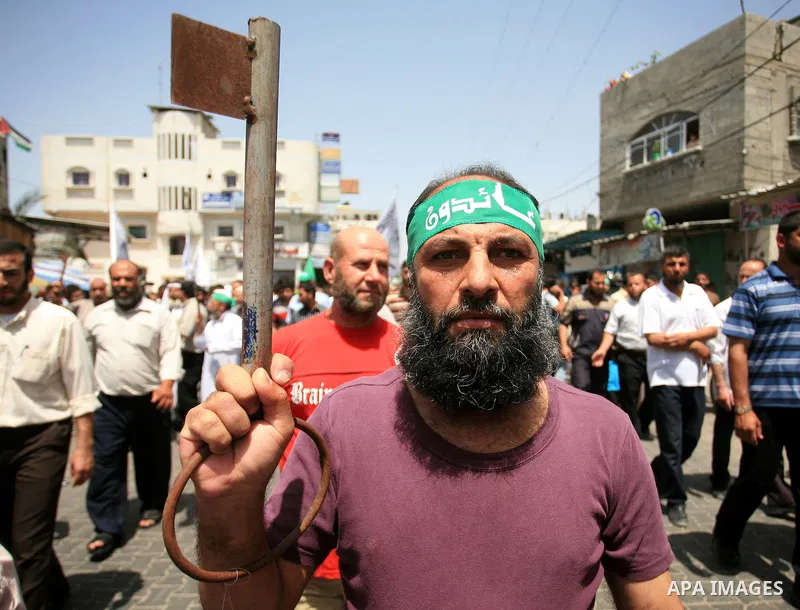 Palestinian man holds a key symbolizing the keys to houses left by Palestinians in 1948 during a rally marking the anniversary of the "Nakba", Arabic for catastrophe, in the Jabaliya refugee camp, northern Gaza Strip, Fr...