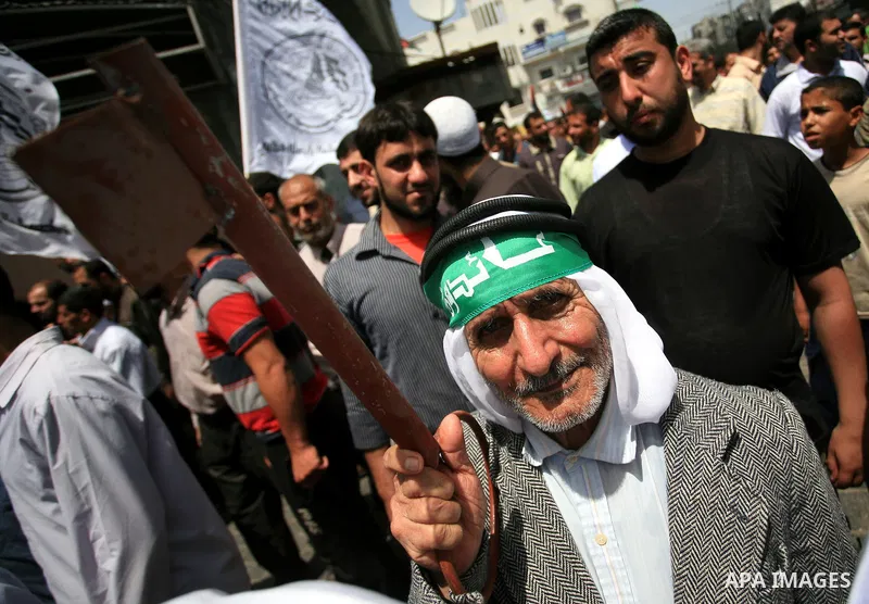 Palestinian man holds a key symbolizing the keys to houses left by Palestinians in 1948 during a rally marking the anniversary of the "Nakba", Arabic for catastrophe, in the Jabaliya refugee camp, northern Gaza Strip, Fr...