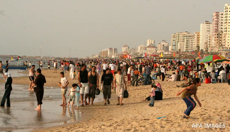 Palestinians gather at the beach of Gaza City May 14, 2010. Photo by Ali Jaad Allah.