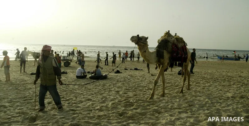 Palestinians gather at the beach of Gaza City May 14, 2010. Photo by Ali Jaad Allah.