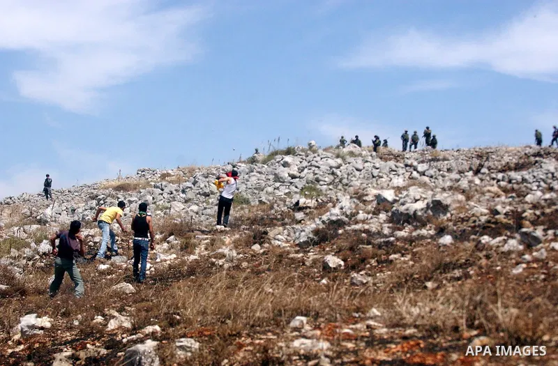 Palestinian protesters clash with Israeli soldiers during a demonstration against the expansion of Jewish settlements in the West Bank village of Iraq Burin, south of Nablus, on May 15, 2010 as Palestinians marked 62 yea...
