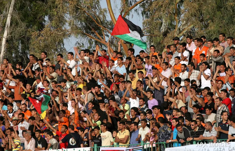 Palestinian fans attend a soccer match between France and Jordan during the final match of Gaza's version of the World Cup in Gaza City on May 15,2010. The Gaza Strip kicked off its own version of the World Cup with team...