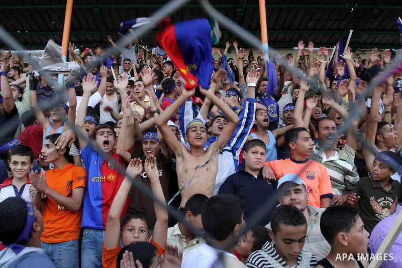 Palestinian fans attend a soccer match between France and Jordan during the final match of Gaza's version of the World Cup in Gaza City on May 15,2010. The Gaza Strip kicked off its own version of the World Cup with team...
