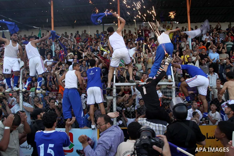 Palestinian players of France celebrate after the winning in a soccer match with Jordan during the final match of Gaza's version of the World Cup in Gaza City on May 15,2010. The Gaza Strip kicked off its own version of...