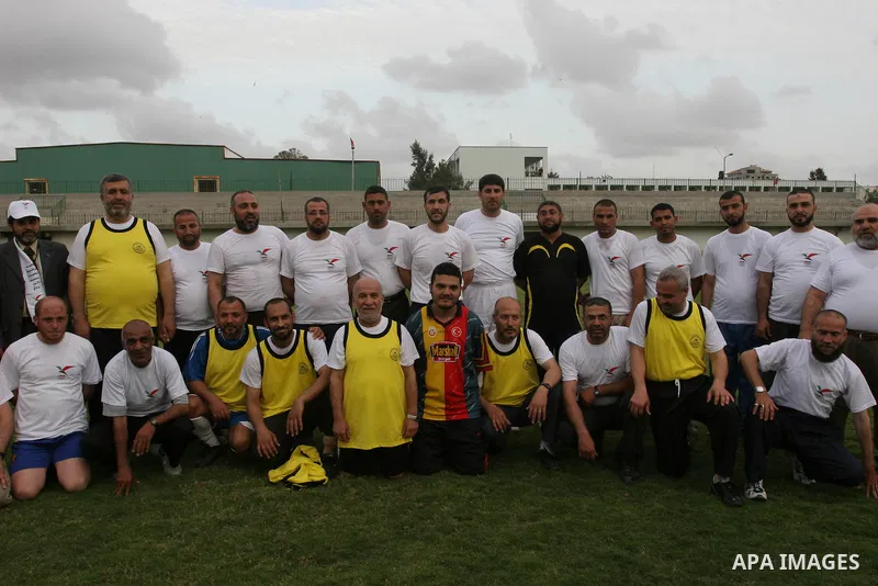 Palestinian ministers, Parliament members and released prisoners take part in a football match in Gaza City on May 18,2010. Photo by Mohammed Asad