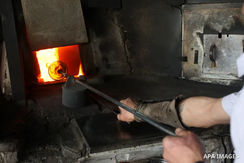 Palestinian worker makes a different types of glasses in AL-Salam factory in the West Bank city of Hebron on May 21, 2010. Glass has been a traditional industry in Hebron for over 600 years but as a result of the increas...