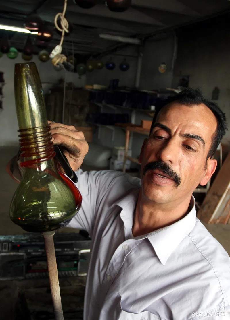 Palestinian worker makes a different types of glasses in AL-Salam factory in the West Bank city of Hebron on May 21, 2010. Glass has been a traditional industry in Hebron for over 600 years but as a result of the increas...