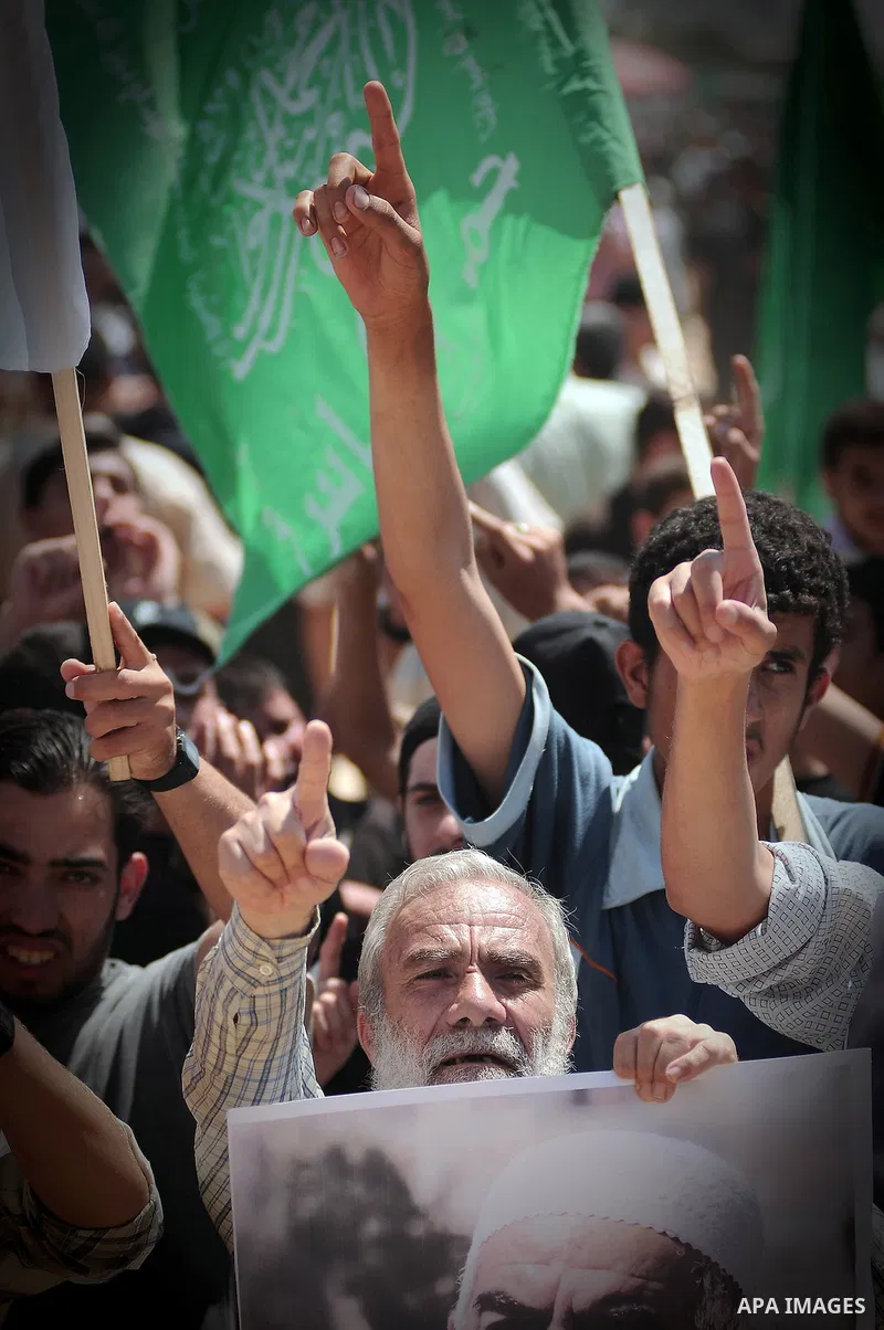 Palestinian Hamas supporters take part in anti-Israeli protest at the port of Gaza City on May 31, 2010. At least 10 activists were killed in an Israeli naval takeover on Monday of a Gaza-bound aid convoy, an Israeli mil...
