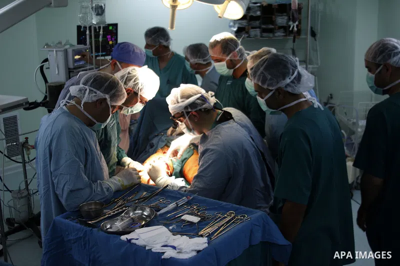 Palestinian medical team performs surgery operation to a Palestinian youth after an Israeli settler fires at him, at Al-Ahly hospital in the West Bank city of Hebron on June 3,2010. Photo by Mamoun Wazwaz