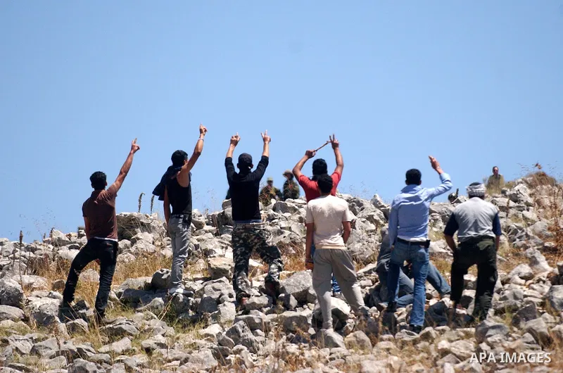 Palestinian youths throw stones at Israeli soldiers during an anti-Israeli demonstration in the West Bank village of Iraq Burin, near the city of Nablus, Saturday, June 5, 2010. Israeli forces seized Saturday the Gaza-bo...