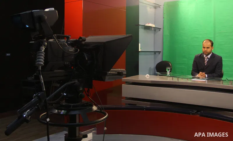Palestinian man works in the offices of the Hamas-run Al-Aqsa TV in Gaza City on June 15, 2010 after Paris decided to take the Gaza station off the air in France within 48 hours because of "incitement to hatred.". Photo...
