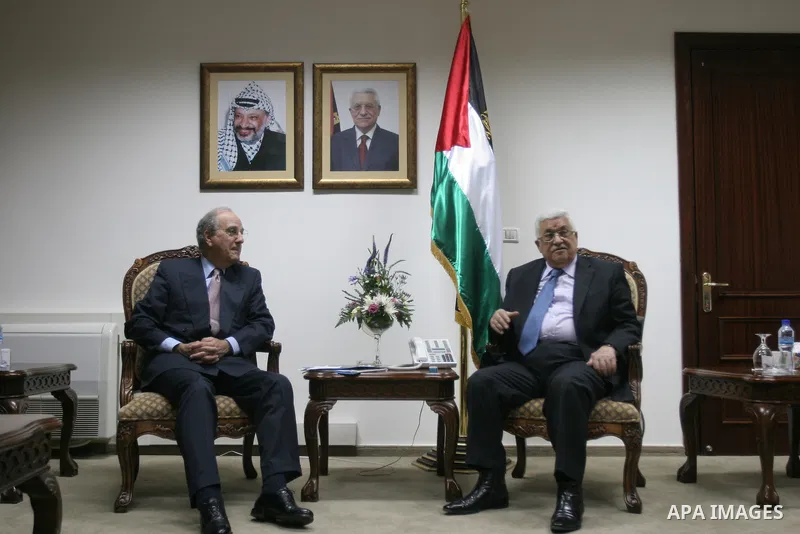 US Middle East envoy George Mitchell is greeted by Palestinian leader Mahmud Abbas at the Palestinian Authority headquarters in the West Bank city of Ramallah on June 18, 2010. Photo by Majdi Mohammed/pool