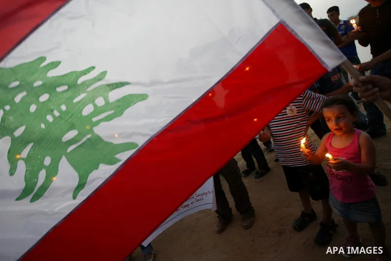 Palestinians take part in a candle light rally to show support with Lebanese aid flotilla which is expected to reach blockaded Gaza soon, at the Gaza seaport, June 21, 2010. The Israeli decision to ease the blockade of G...