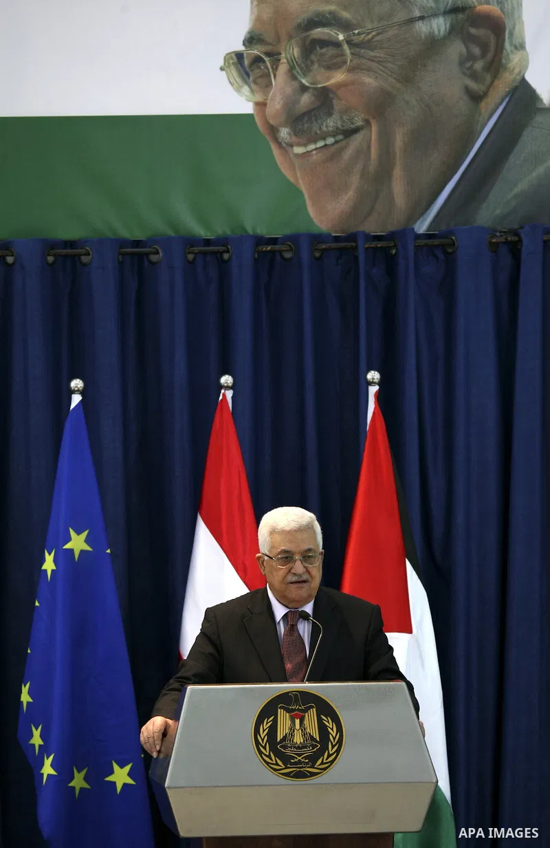 Palestinian President Mahmoud Abbas and Austrian Chancellor Werner Faymann (not seen) hold a joint news conference in the West Bank city of Ramallah on June 24, 2010. Photo by Eyad Jadallah
