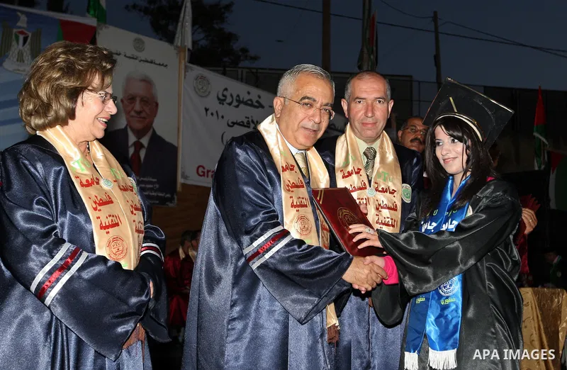Palestinian Prime Minister Salam Fayyad attends graduation ceremony at Palestine Technical University-Kadoorie in the West Bank town of Tulkarem on June 26,2010. Photo by Mustafa Abu Dayeh / Pool