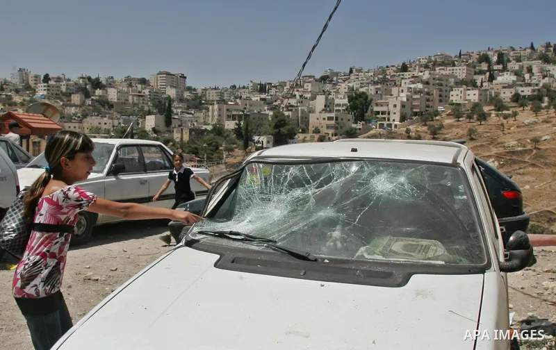 Palestinians inspect the damage in cars by Israeli soldiers after clashes with Palestinian protesters in the Arab east Jerusalem neighbourhood of Silwan on June 28, 2010. Photo by Mahfouz Abu Turk