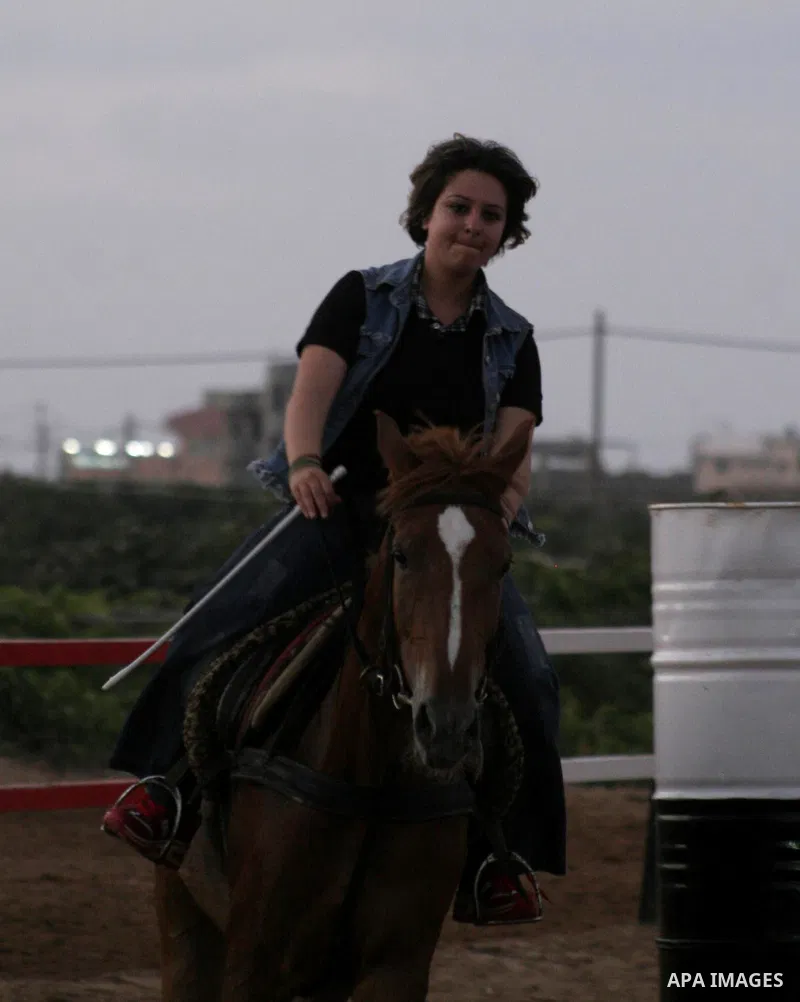 Palestinian girls and boys ride their horses in a club in Gaza City on June 30, 2010. Photo by Yousef Deeb