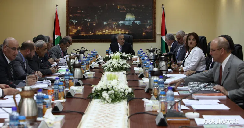 Palestinian Prime Minister Salam Fayyad heads the cabinet meeting number 55 in the West Bank city of Ramallah on July 5,2010. Photo by Mustafa Abu Dayeh / Pool
