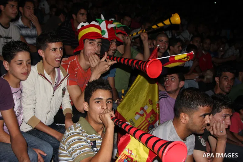 Palestinian fans of Spain celebrates during the semifinal match between Germany and Spain in the West Bank city of Nablus on July 7,2010, the Spanish national soccer team defeated Germany in their South Africa soccer FIF...