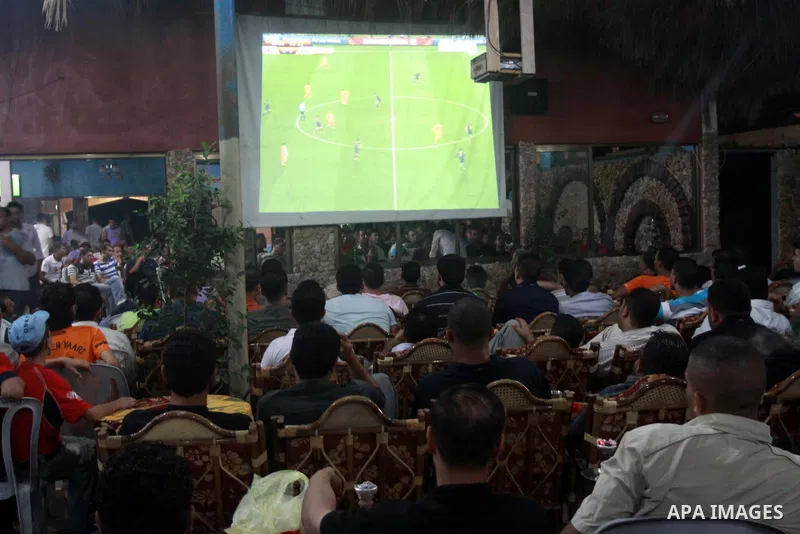 Palestinians watch the final match of the World Cup between Spain and the Netherlands being played in South Africa in Gaza city on July 11,2010. Photo by Mohammed Asad