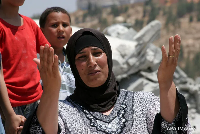 Palestinians inspect a demolished house in the village of Al-Samoua near the West Bank city of Hebron on July 15 2010. The Israeli government claimed that the houses that were demolished were not licensed, but the homeow...