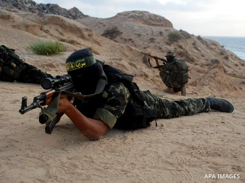 Masked Palestinian militants from Islamic Jihad take part in a training exercise in Gaza City on July 15,2010. Photo by Yousef Deeb