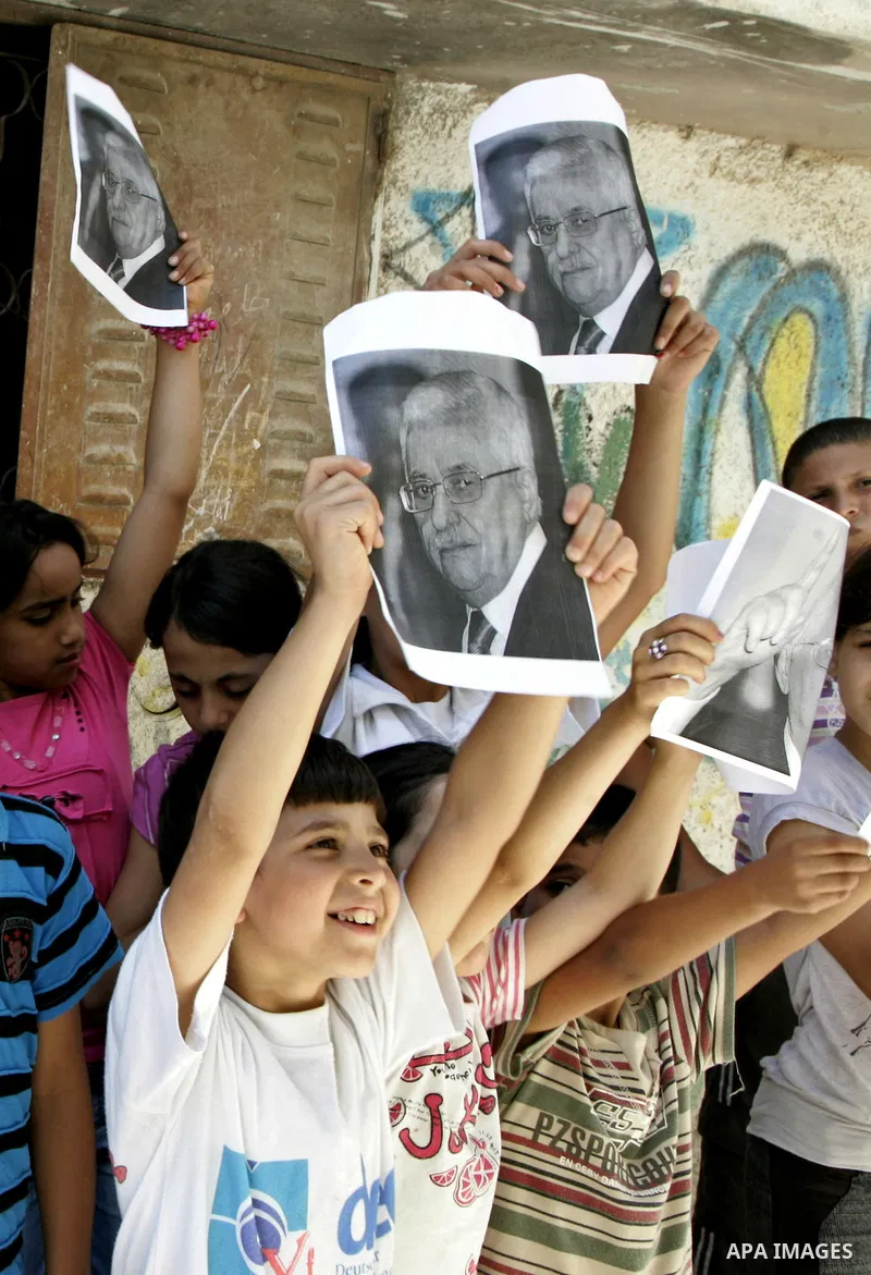Palestinian children hold posters of President Mahmoud Abbas during a rally to support the peace process in Balata refugee camp near the west bank city of Nablus on July 17, 2010. Photo by Wagdi Eshtayah