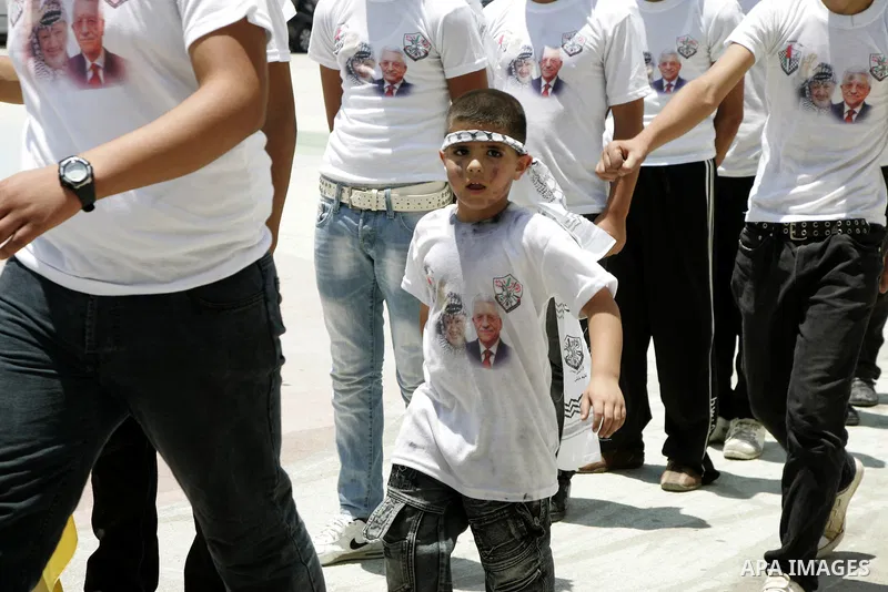 Palestinian children from the Fatah party participate in a training session during a summer camp in the West Bank city of Nablus, Sunday, July 18, 2010. Photo by Wagdi Eshtayah
