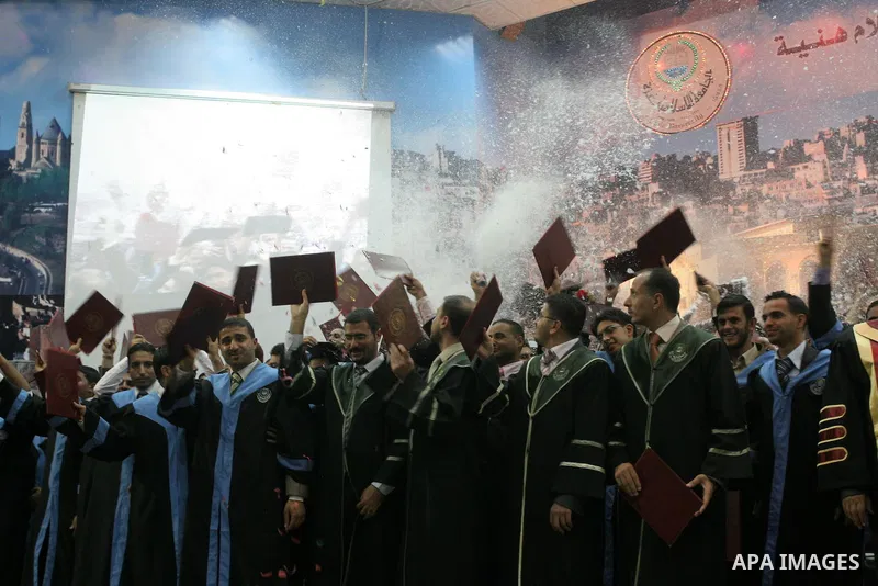 Palestinian students are seen during their graduation ceremony in the Islamic University in Gaza city on July 26, 2010. Photo by Mohammed Asad