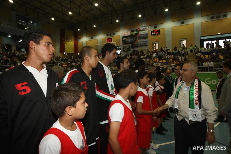 Palestinian Prime Minister Salam Fayyad attends the opening celebration of the closed Hebron sport hall in the West Bank city of Hebron on July 30,2010. Photo by Mustafa Abu Dayeh / Pool