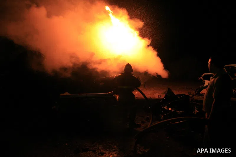 Palestinian fire fighter works on the scene following Israeli air-strike at a military site for Hamas in Gaza City, July 31, 2010. Israeli war jets struck on Friday night three targets in Gaza Strip, wounding at least ni...