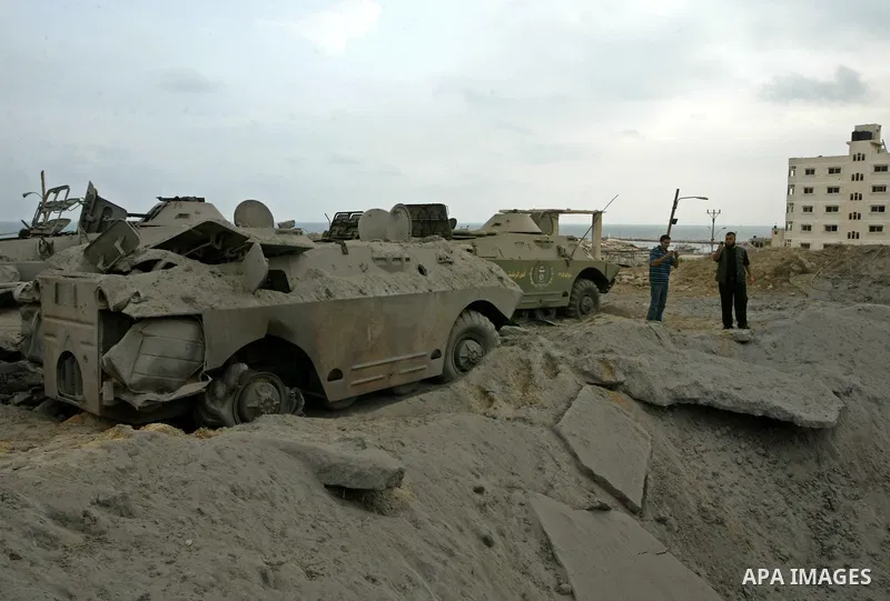 Member of Hamas' security forces surveys the damage after Israeli air strikes at a training camp in Gaza City July 31, 2010. Israel carried out air strikes on targets in the Gaza Strip on Friday after a rocket fired from...