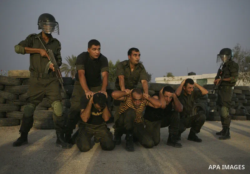 Members of the Palestinian security forces demonstrate their skills during a graduation ceremony in the West Bank city of Jericho, July 31, 2010. Photo by Eyad Jadallah