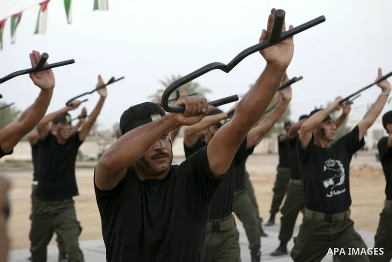 Members of the Palestinian security forces demonstrate their skills during a graduation ceremony in the West Bank city of Jericho, July 31, 2010. Photo by Eyad Jadallah