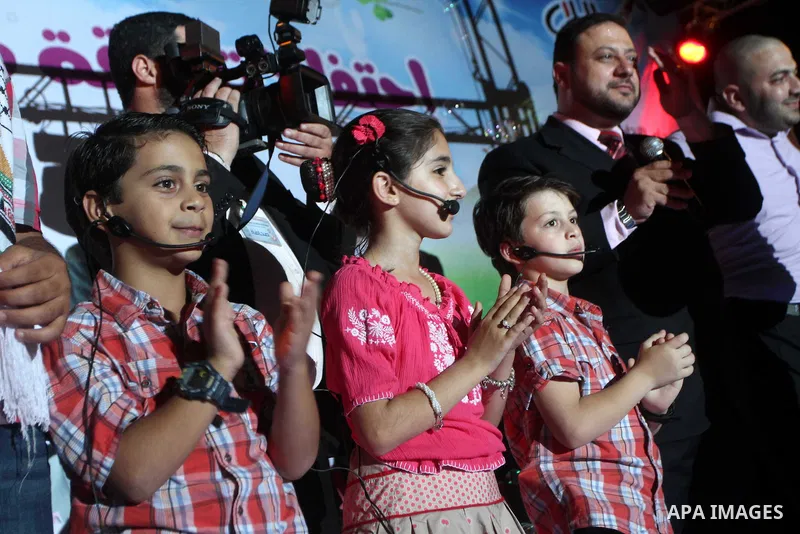 Member of the Birds of Paradise team sing during an Islamic song festival in Gaza City on August 3, 2010. Photo by Ashraf Amra